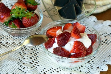 Strawberry dessert with greek yogurt decorated with chocolate. 
