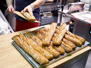 Baker with freshly baked bread