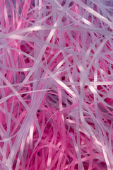 This is a photograph of Pink and Blue shredded plastic fake Easter grass background