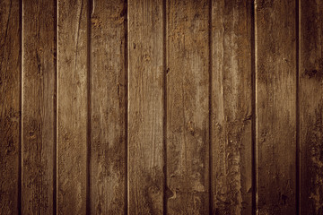 Old rural wooden wall in warm brown colors, detailed plank photo texture. Natural wooden building structure background.