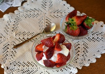 Healthy greek yogurt with chopped fresh strawberry for breakfast.