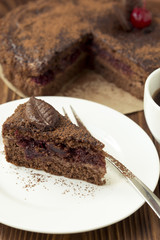 Piece of chocolate cake with cherry