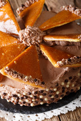 Traditional Hungarian Dobosh cake with caramel decoration macro. vertical