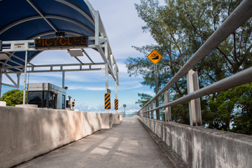 Bicycle lane signage on street for special bicycle road on Rickenbacker causeway for Key Biscayne. Near the ocean and Virginia Key. Miami. Florida. USA. Miami neighborhood.