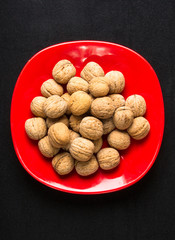walnuts in red plate