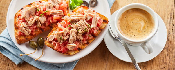 Seafood tostada topped with salsa and tuna