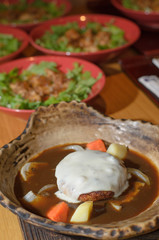 Hamberger grilled and soup soy beans in clay pot