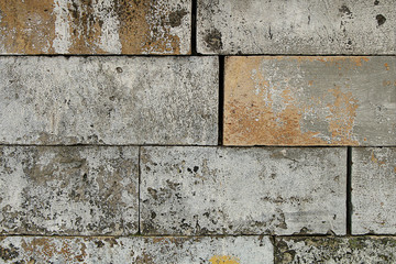 Wall of light concrete blocks of the same size.