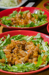 Chicken fried and salad mix in dish