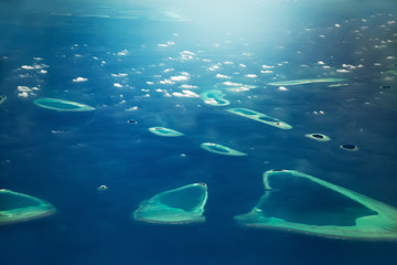 Fototapeta na wymiar Aerial high angle view to tropical islands at Maldives