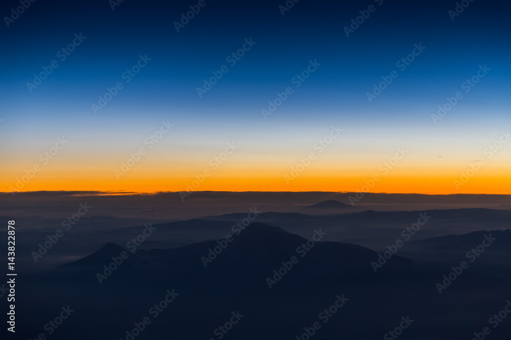 Wall mural aerial view from airplane window at twilight