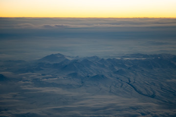 Fototapeta na wymiar Aerial view from air plane of snow mountains