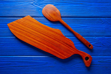 Chef tool spatula and table board on blue