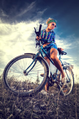 Fototapeta na wymiar Girl with a bicycle.