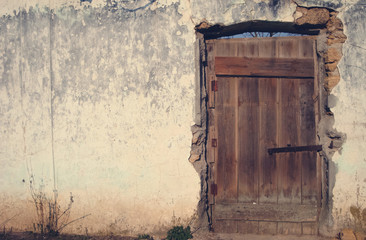 Vintage wall. The old door on the side and the backdrop of the background.