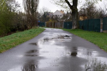 Puddle on road during rain. Slovakia