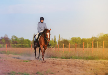 Girl jockey riding a horse