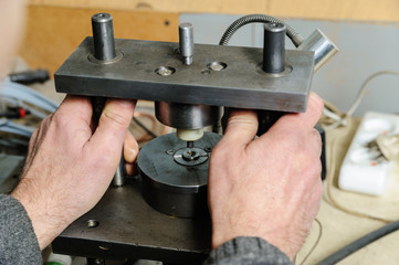 Mechanics a repairing diesel injector.