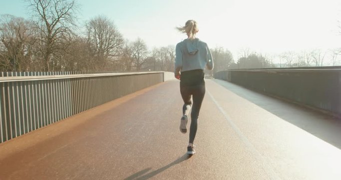 Young woman doing cardio in sunny day