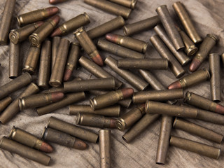 A lot of pistol bullets and lies on a rag.
