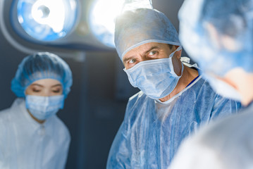 Serious doctor in operating theatre