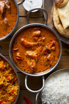 top down image of indian butter chicken in balta dish