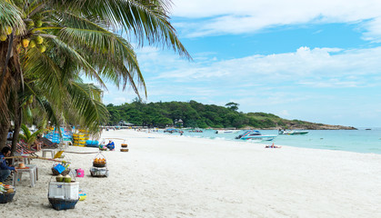 Tropical wide beach of Samet island with few visitors and beach sellers