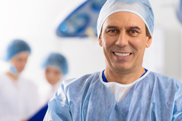 Happily smiling male medical person