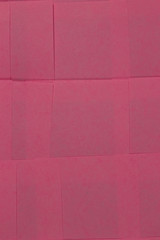 This is a photograph of Pink Sticky notes background