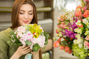 Cheerful female client buying flowers