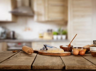 Baking ingredients placed on wooden table © Jag_cz