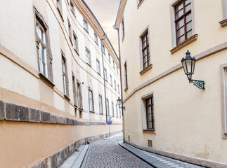 Fototapeta na wymiar narrow old classic empty street in Prague, central Europe