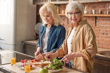 Cheerful mature ladies caring of their health
