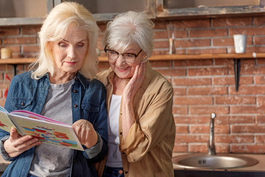 Two Senior Ladies Deciding What To Cook