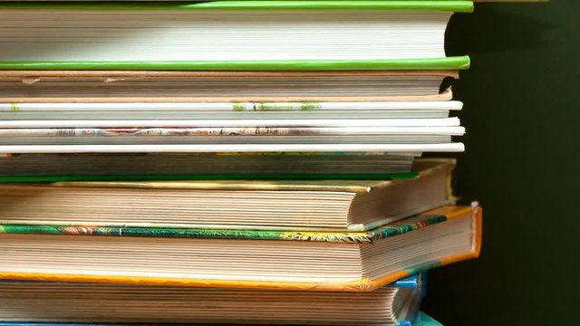 camera movement along a stack of books
