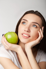 woman beauty girl with fruits oranges on gray white background apple