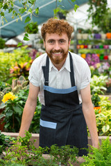 Male florist posing at his greenhouse