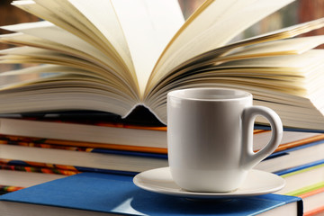 Composition with books and cup of coffee