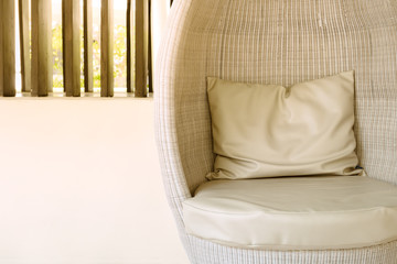 Fototapeta na wymiar Rattan sofa seat with pillow in hotel or resort