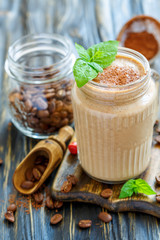 Invigorating coffee smoothie in a glass jar.