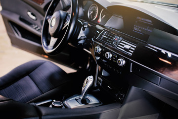 Fototapeta na wymiar Luxury car interior. Automatic shift lever. 