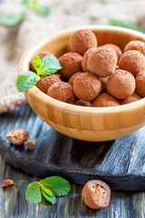 Wooden bowl with homemade chocolates.