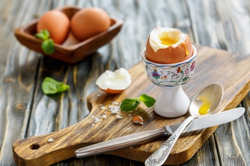 Boiled soft-boiled egg in the stand.