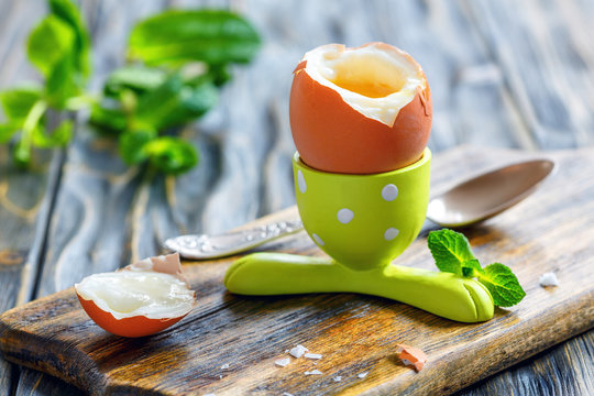 The Soft-boiled Egg In A Funny Green Stand.