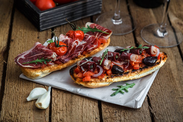 Smoked goose breast on crusty bread with tomato