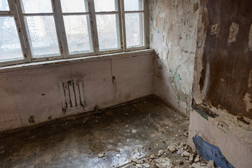 Ruined abandoned room in a house requiring major repairs