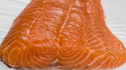 fresh salmon fillet close up on white table