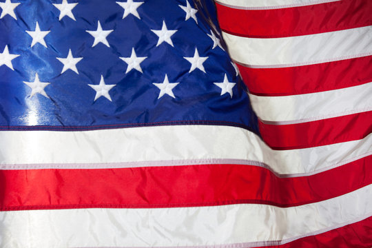 USA flag. American flag. American flag blowing wind.
