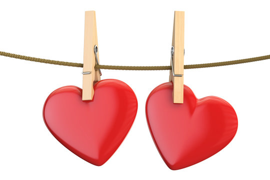Hearts on rope with clothespin, valentine's day concept. 3D rendering