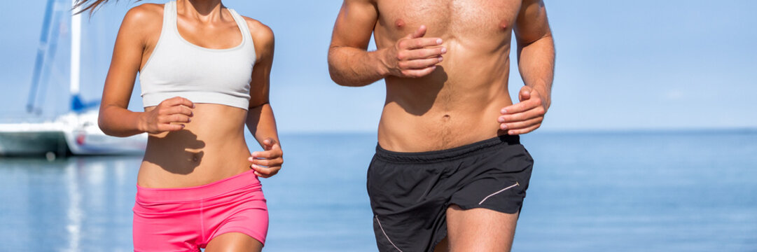 Couple athletes runners running on beach. Fitness people training cardio living an active and healthy lifestyle. beach background copy space. Banner panorama body crop.